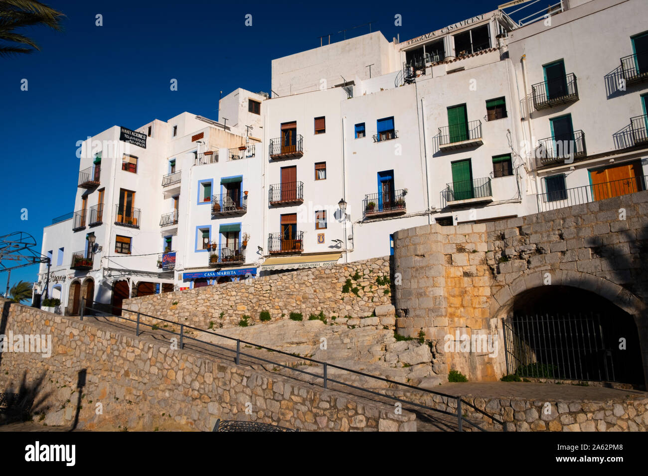 Spanish apartments overlooking the Artilleria Park at Peniscola in Spain. Stock Photo