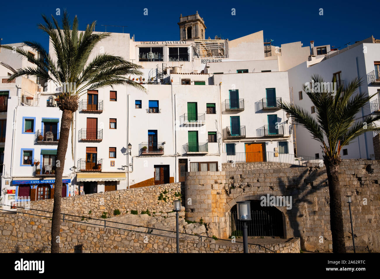 Spanish apartments overlooking the Artilleria Park at Peniscola in Spain. Stock Photo