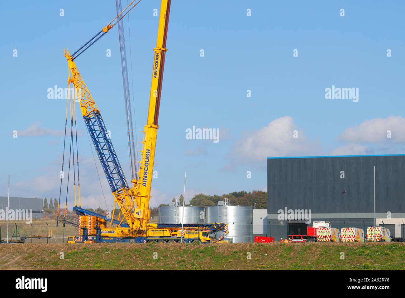 A 1000 tonne crane is set up and ready to lift air conditioning units onto  the new Amazon warehouse at Temple Green in Leeds Stock Photo - Alamy
