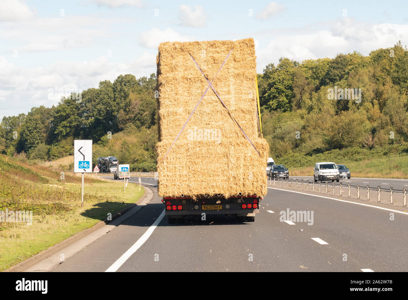 Transporting bales of straw by lorry - UK Stock Photo