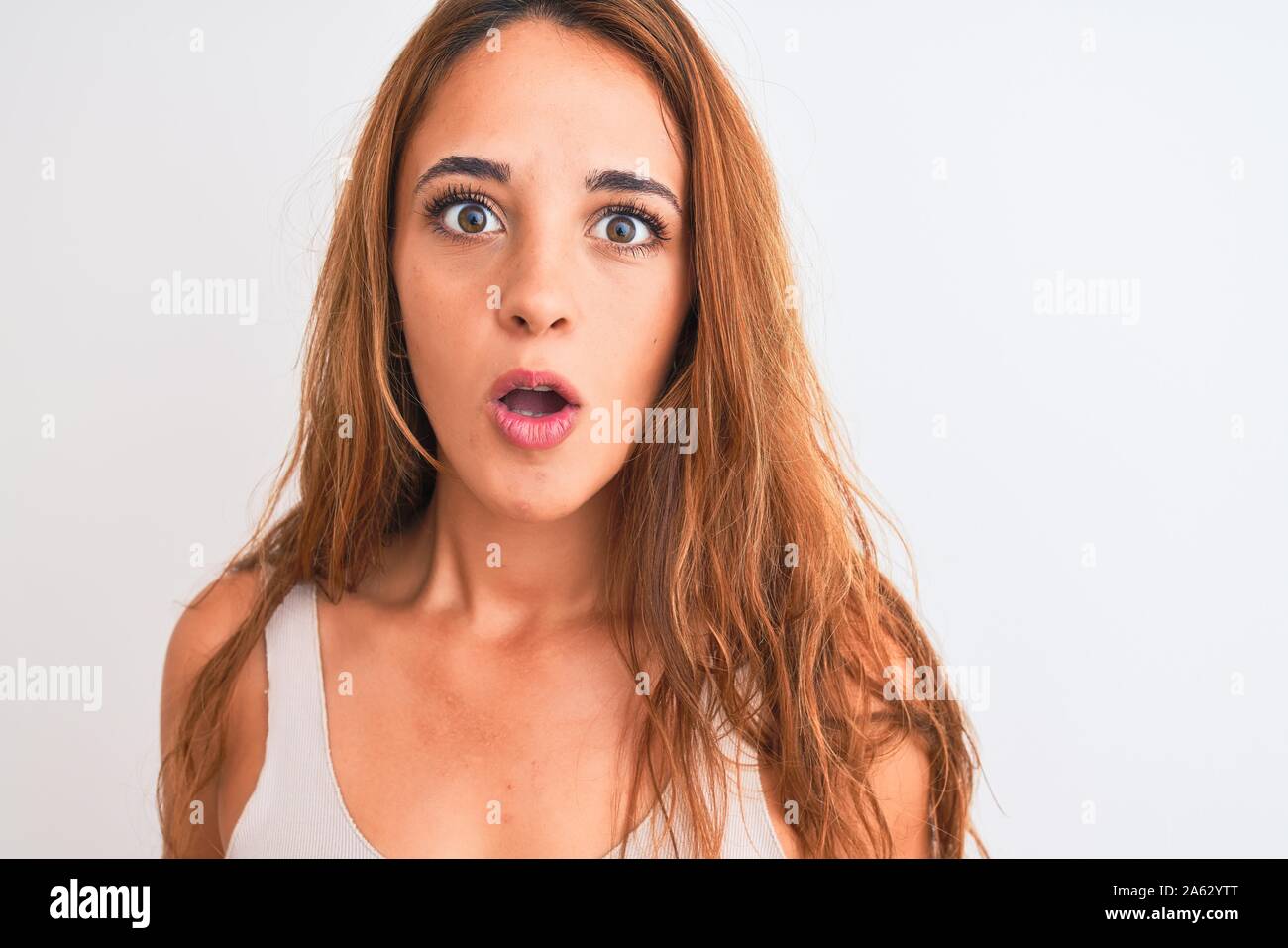 Young Redhead Woman Stading Over White Isolated Background Scared