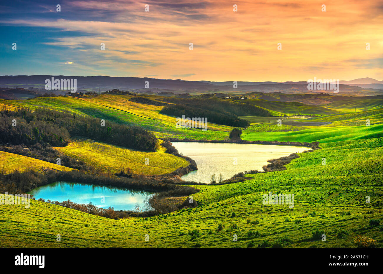 Tuscany landscape, small lakes, green and yellow fields in Crete Senesi. Italy, Europe. Stock Photo