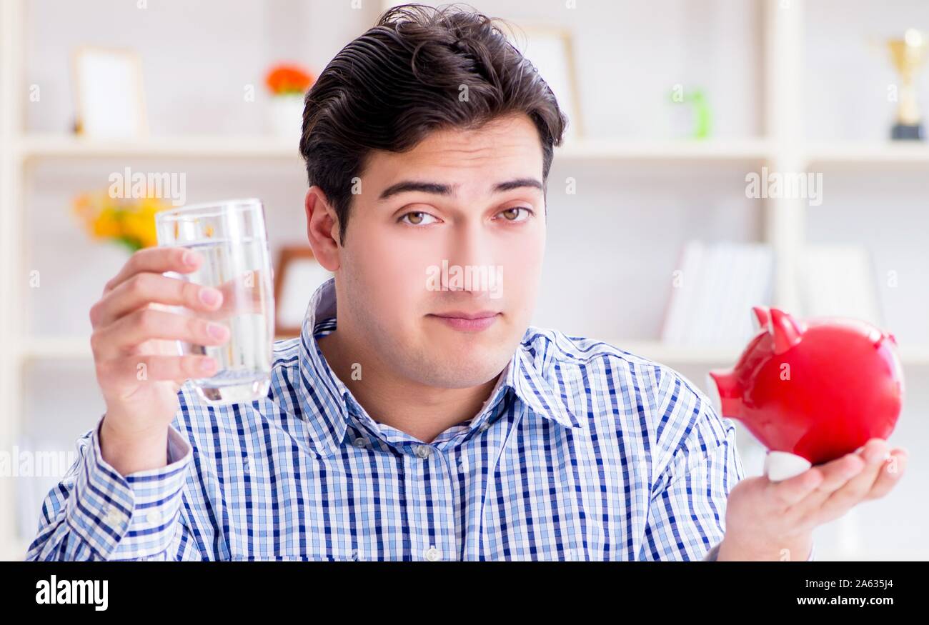 Man running out of money in restaurant and using savings from piggy