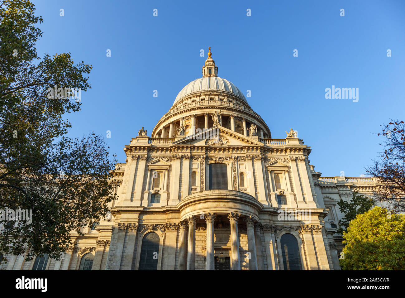 View from St Paul's Churchyard of the London landmark, historic St Paul's Cathedral and dome designed by Sir Christopher Wren on a sunny autumn day Stock Photo