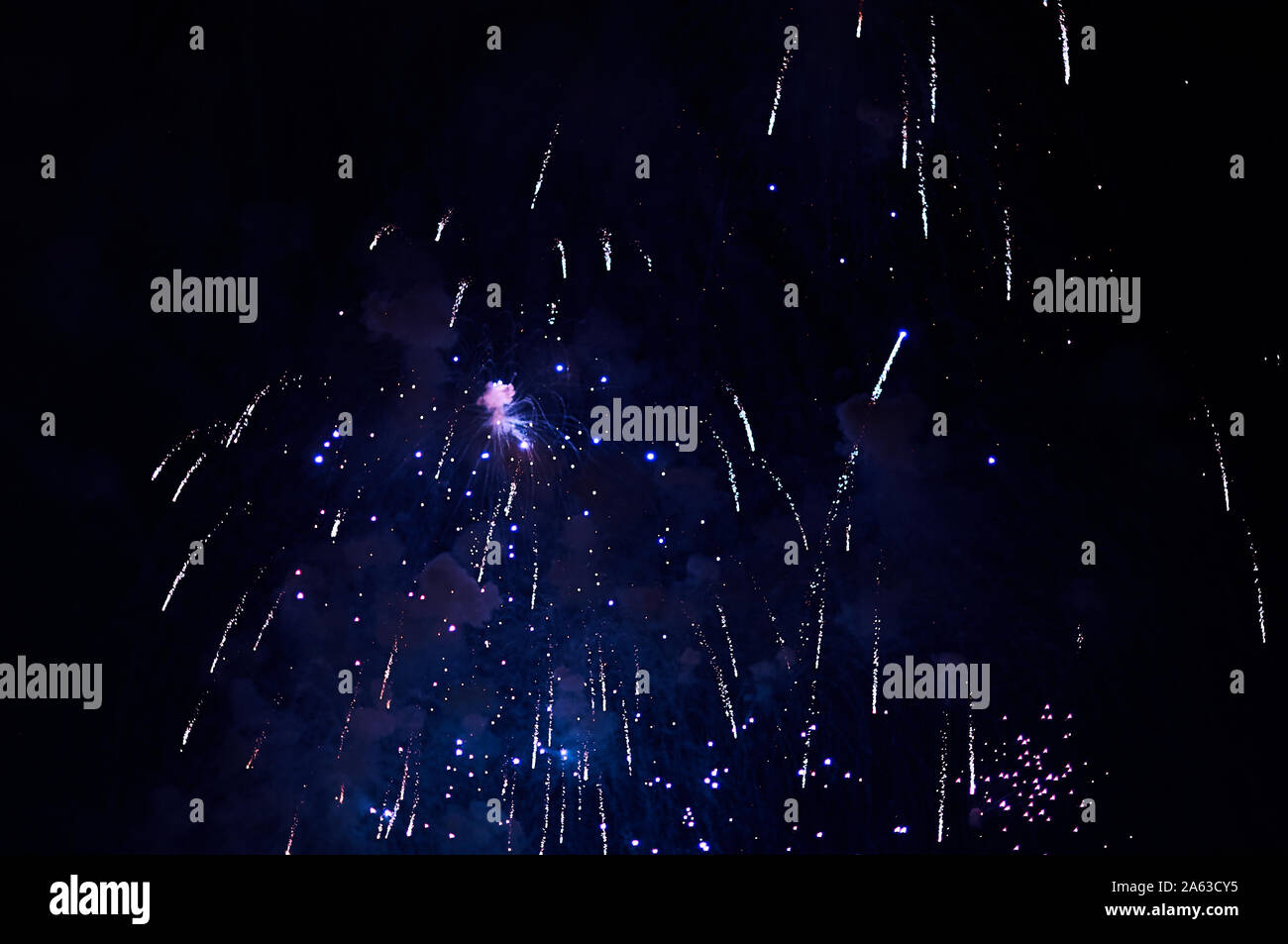 Inexpensive fireworks, over the city, red and blue . For any purpose