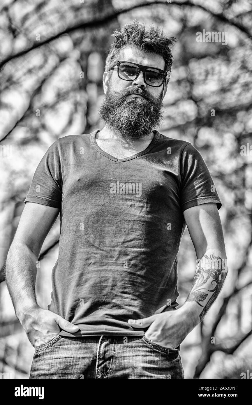 Man bearded with sunglasses nature background. Bearded man wear modern  fashionable sunglasses. Hipster confident in dark sunglasses. UV filter.  Bearded hipster brutal man wear protective sunglasses Stock Photo - Alamy