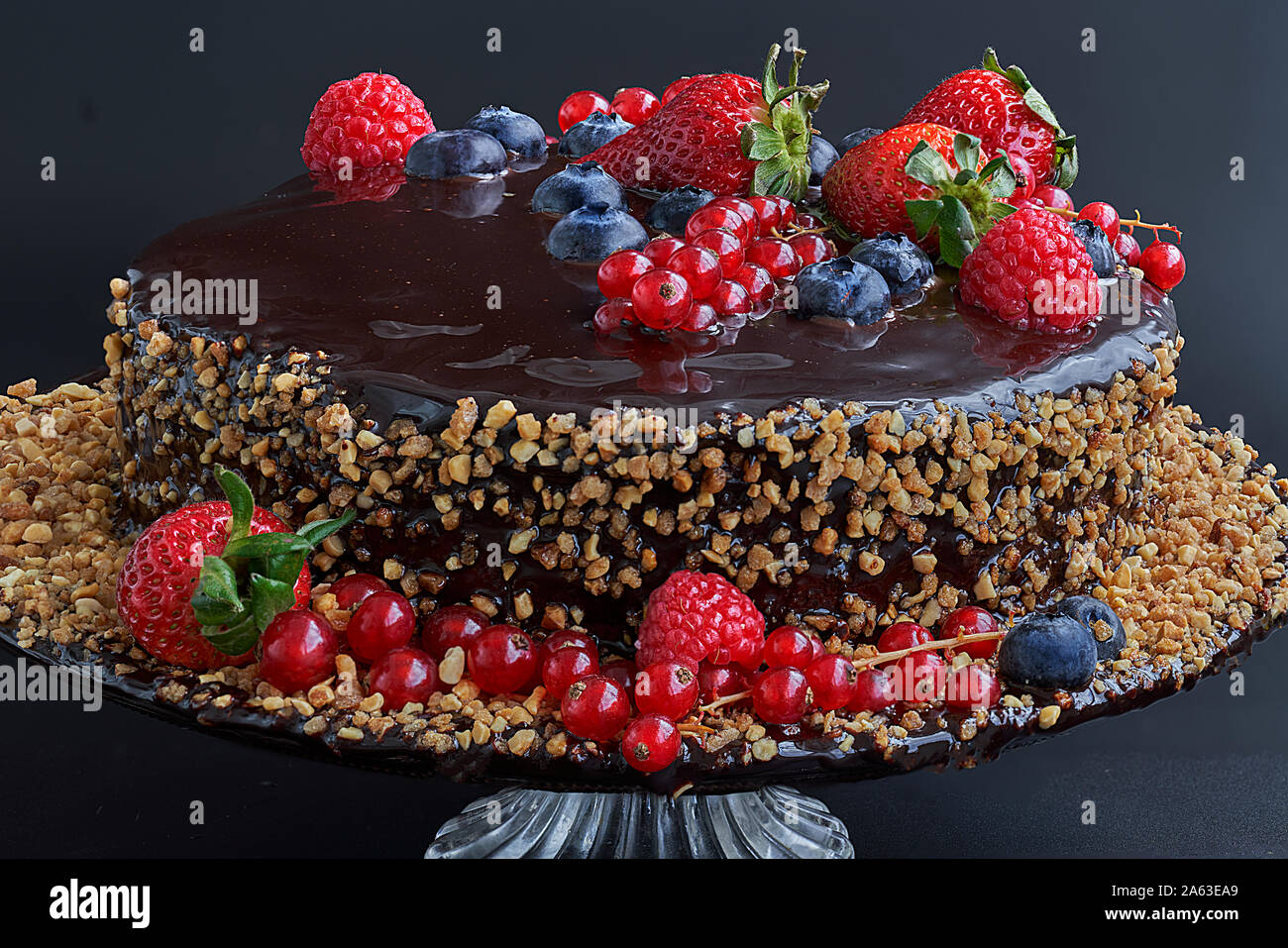 Homemade Chocolate Cake Chocolate Bavaroise With Chocolate Topping Garnished With Red Currants Strawberries Blueberries And Chopped And Toasted Al Stock Photo Alamy