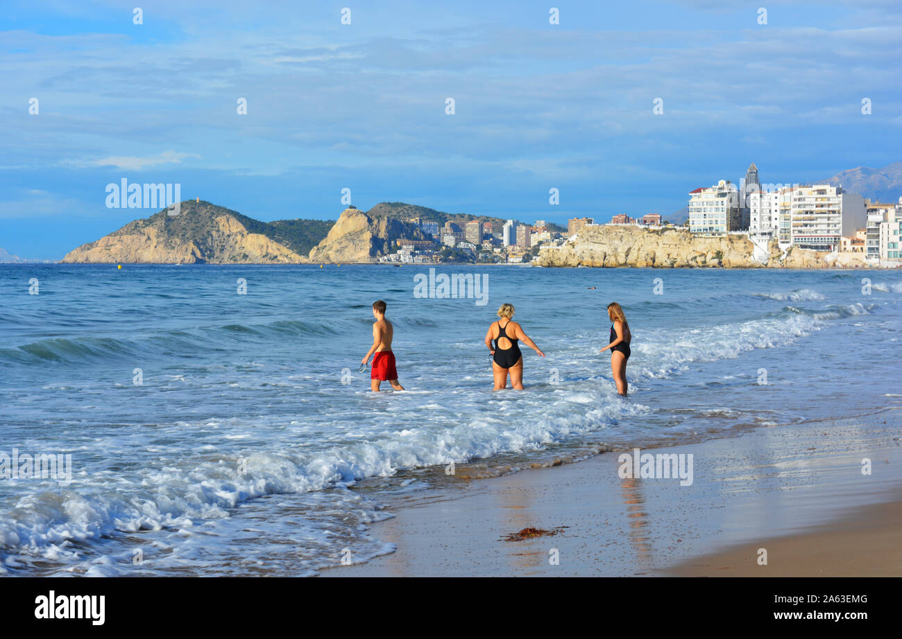 Group of active seniors on Playa Levante beach, with skyscrapers in the background, Benidorm, Alicante Province, Spain Stock Photo
