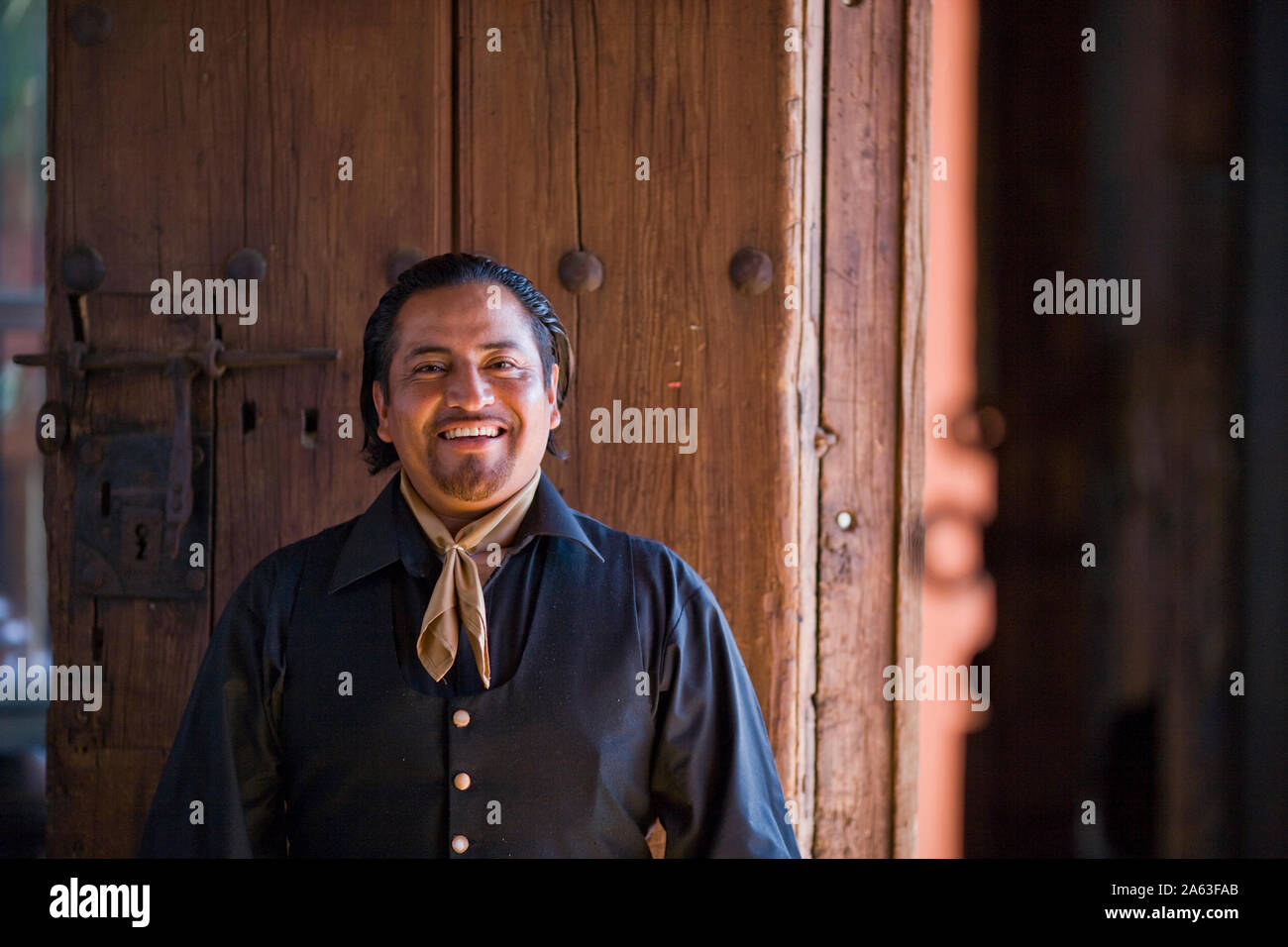 Portrait of a smiling mid-adult man dressed in traditional clothing ...