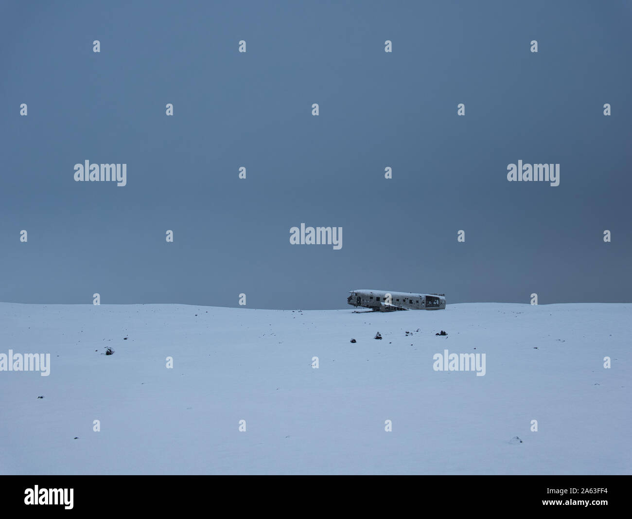 Crashed plane on a snow-covered meadow in Iceland Stock Photo