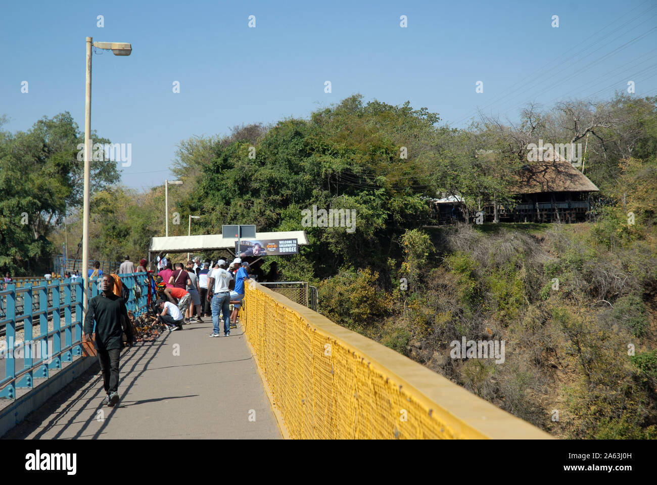 People walking on Victoria Falls Bridge, Zimbabwe, Africa. Stock Photo