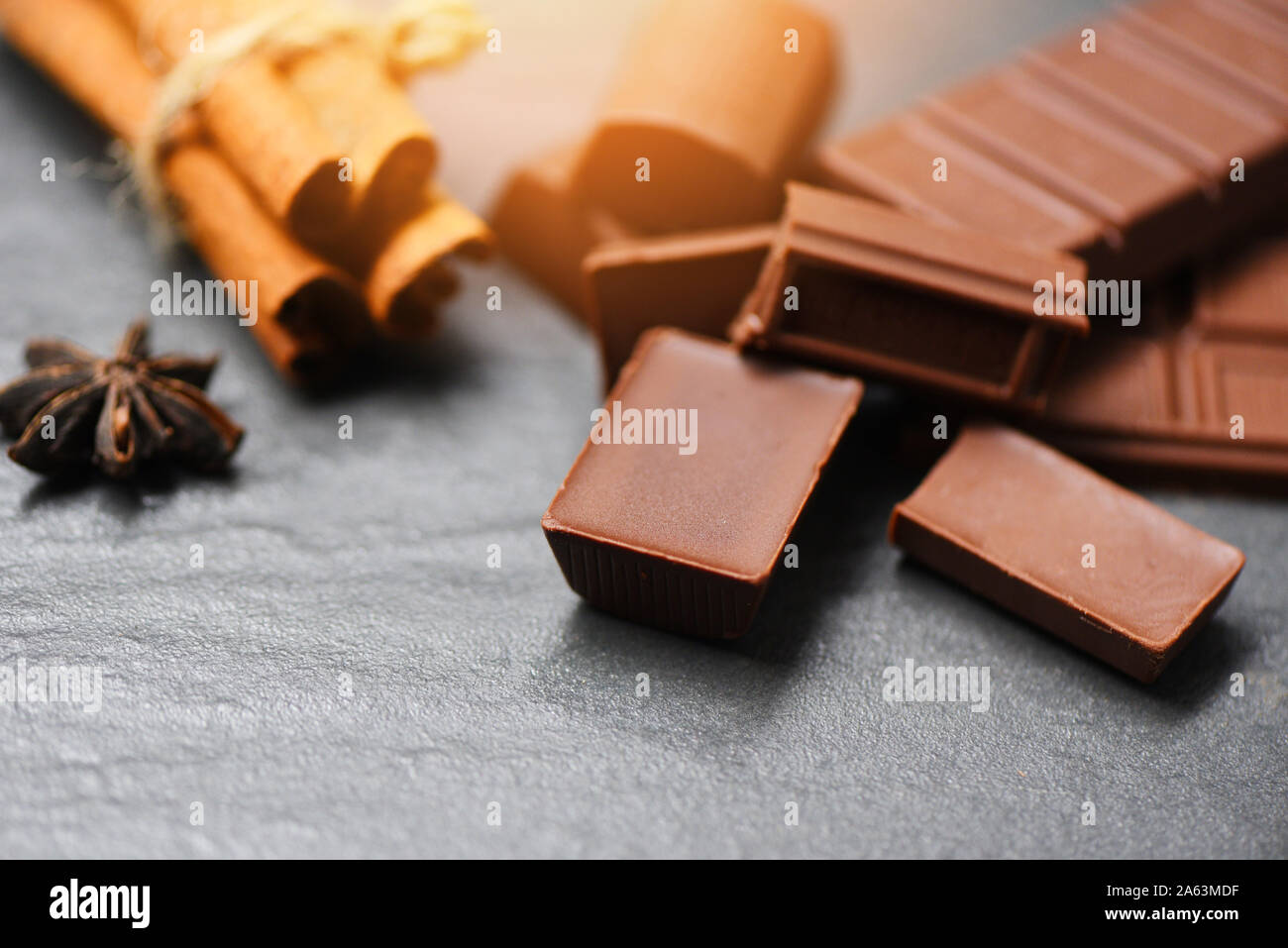 Chocolate Bar And Spice On Dark Background Sweet Dessert For Snack Selective Focus Stock Photo