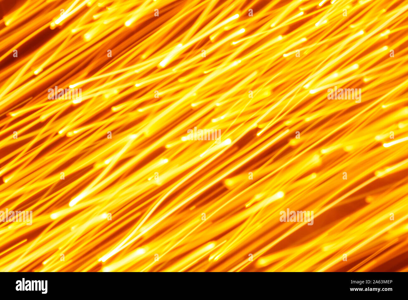Futuristic blurred lights holiday monochrome background in yellow. Horizontal, soft focus Stock Photo