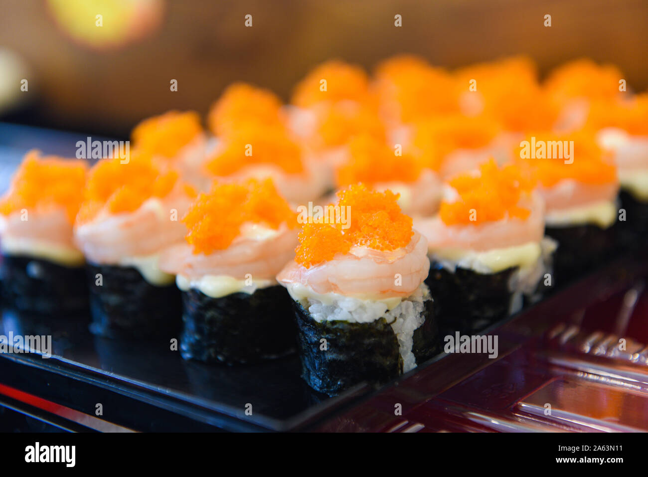Japanese food shrimp sushi roll rice with tobiko egg is orange (flying