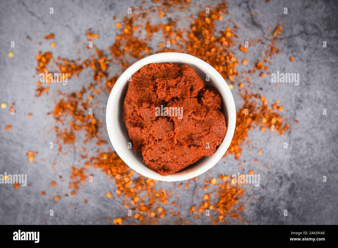 curry paste cayenne pepper and dried chilli peppers background / group