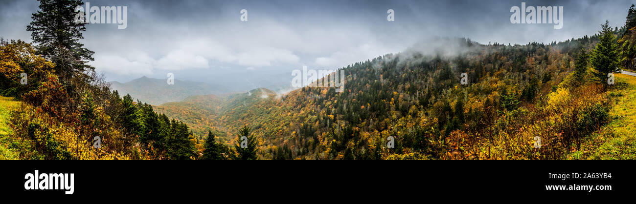 A panoramic overlook off the Blue Ridge Parkway of fall emerging throughout the valley Stock Photo