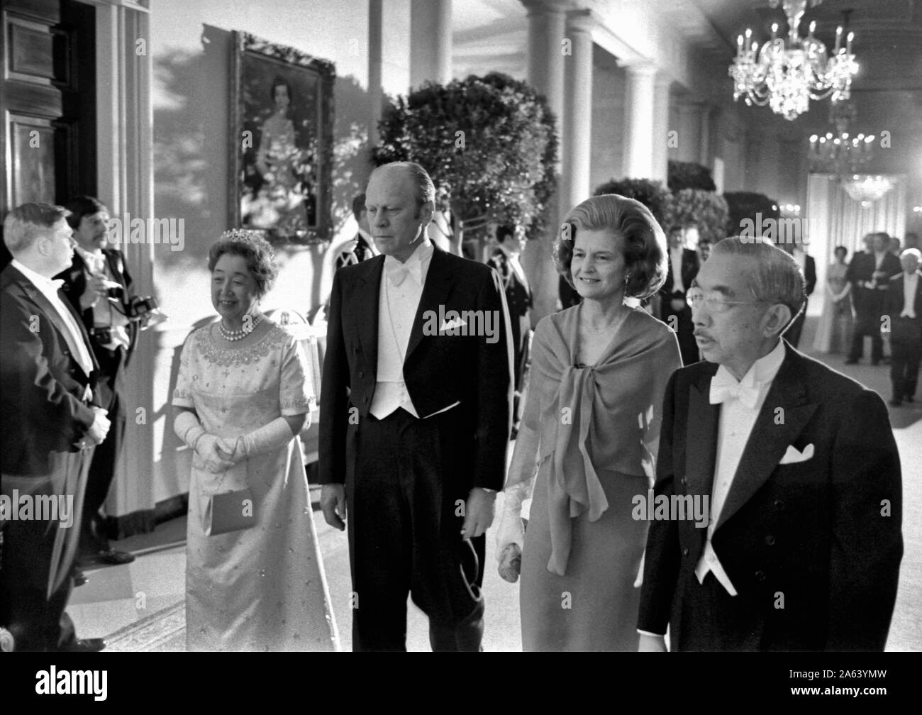 President and Mrs. Ford escort the Emperor (Hirohito, now Showa) and Empress of Japan to a white tie dinner held in honor of their first State Visit to the United States. October 2, 1975 Stock Photo