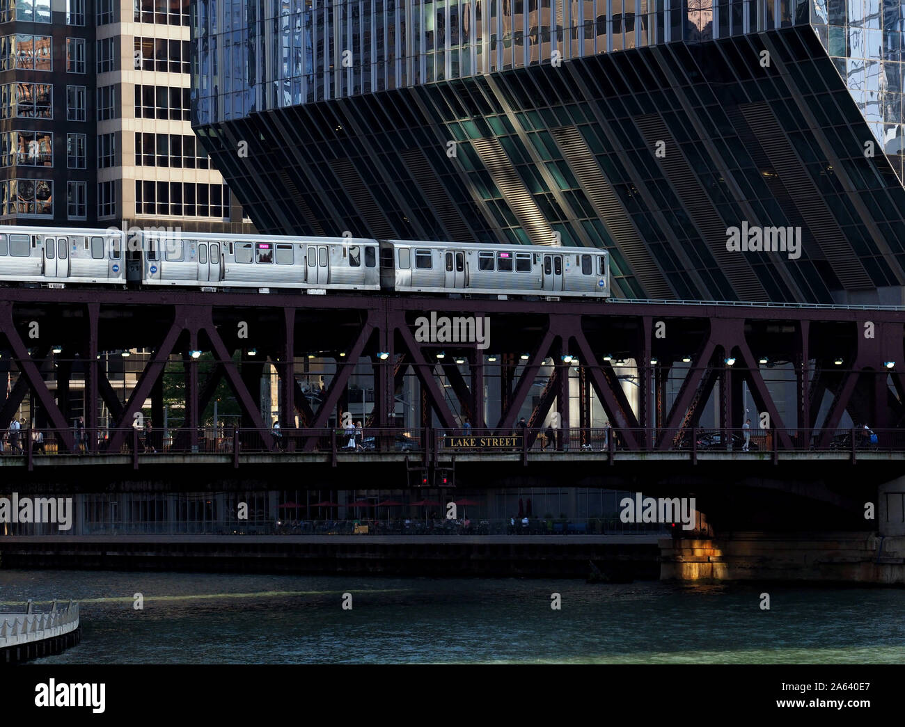 View of a CTA train passing in front of 150 North Riverside Plaza in Chicago, IL Stock Photo