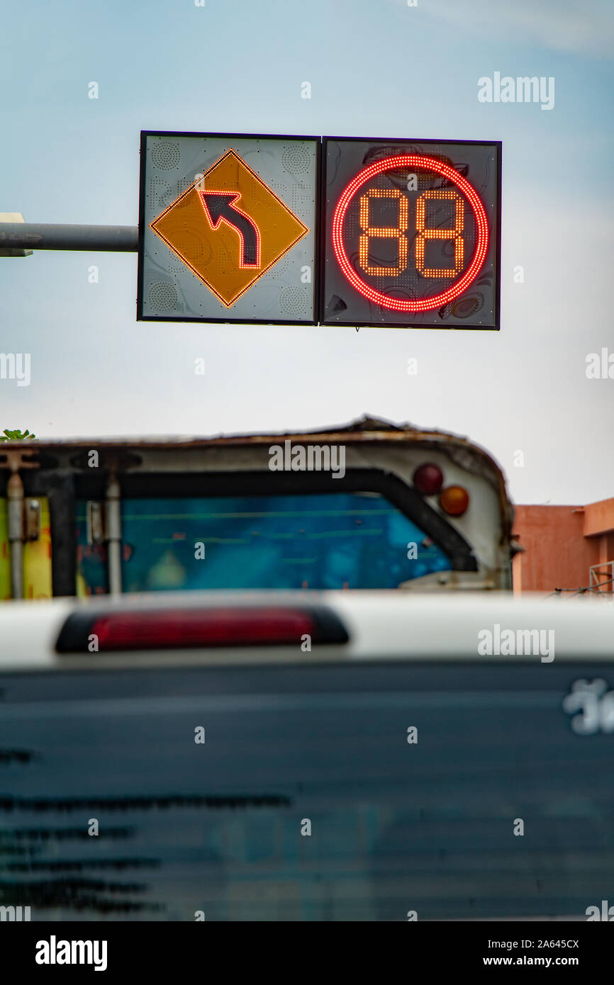 Red light numbers count down time for ride on a crossing. City street