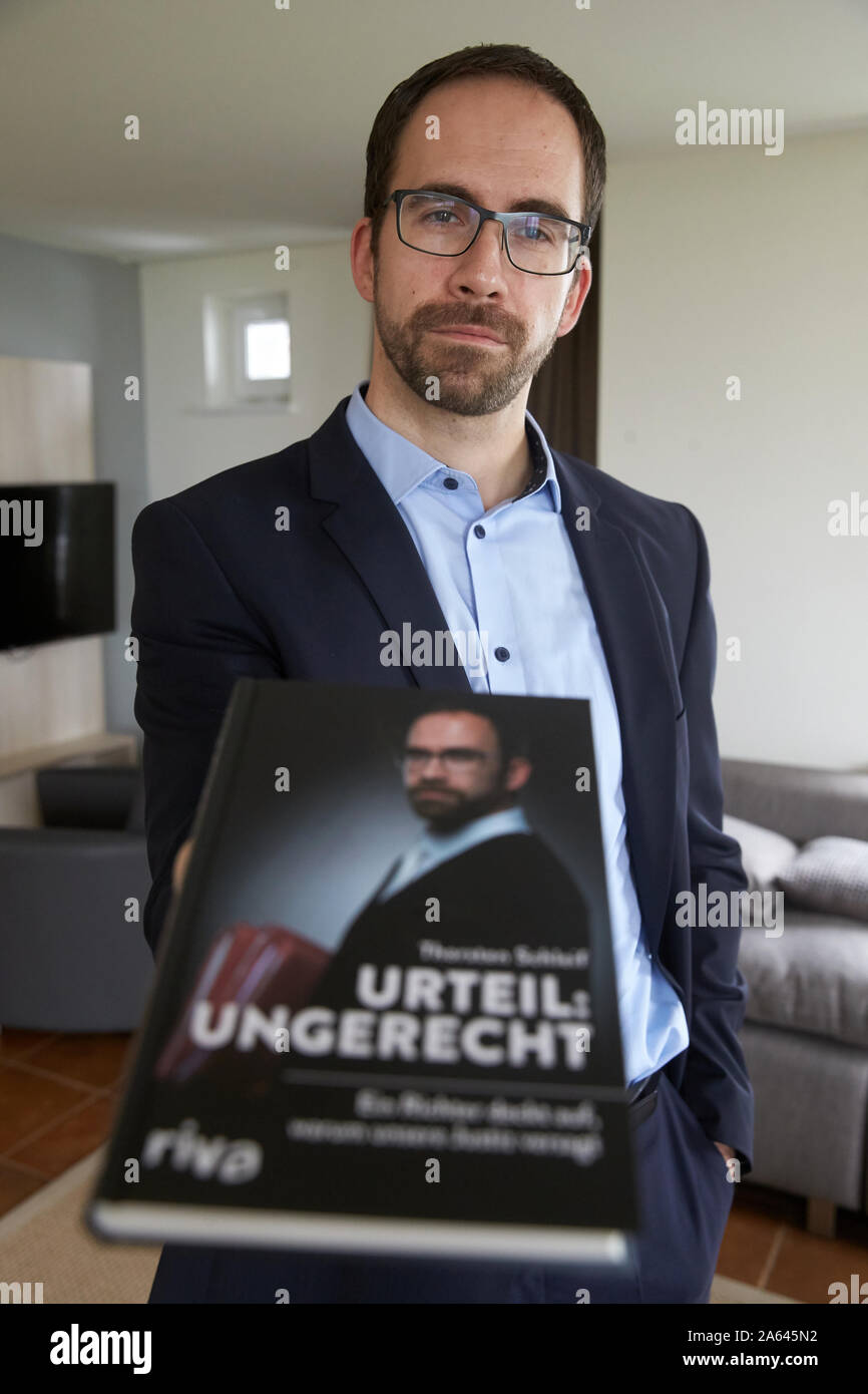 Cochem, Germany. 22nd Oct, 2019. District judge Thorsten Schleif shows his book with the title 'Urteil ungerecht'. In it, he accuses justice of failure. (Zu dpa: The accounting: Judge accuses justice of failure). Credit: Thomas Frey/dpa/Alamy Live News Stock Photo