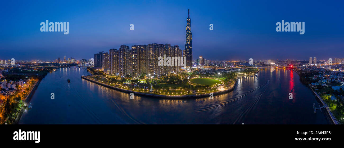 epic evening aerial panorama of Saigon, Ho Chi Minh City, Vietnam featuring all key buildings of the city skyline and the Saigon riverfront Stock Photo