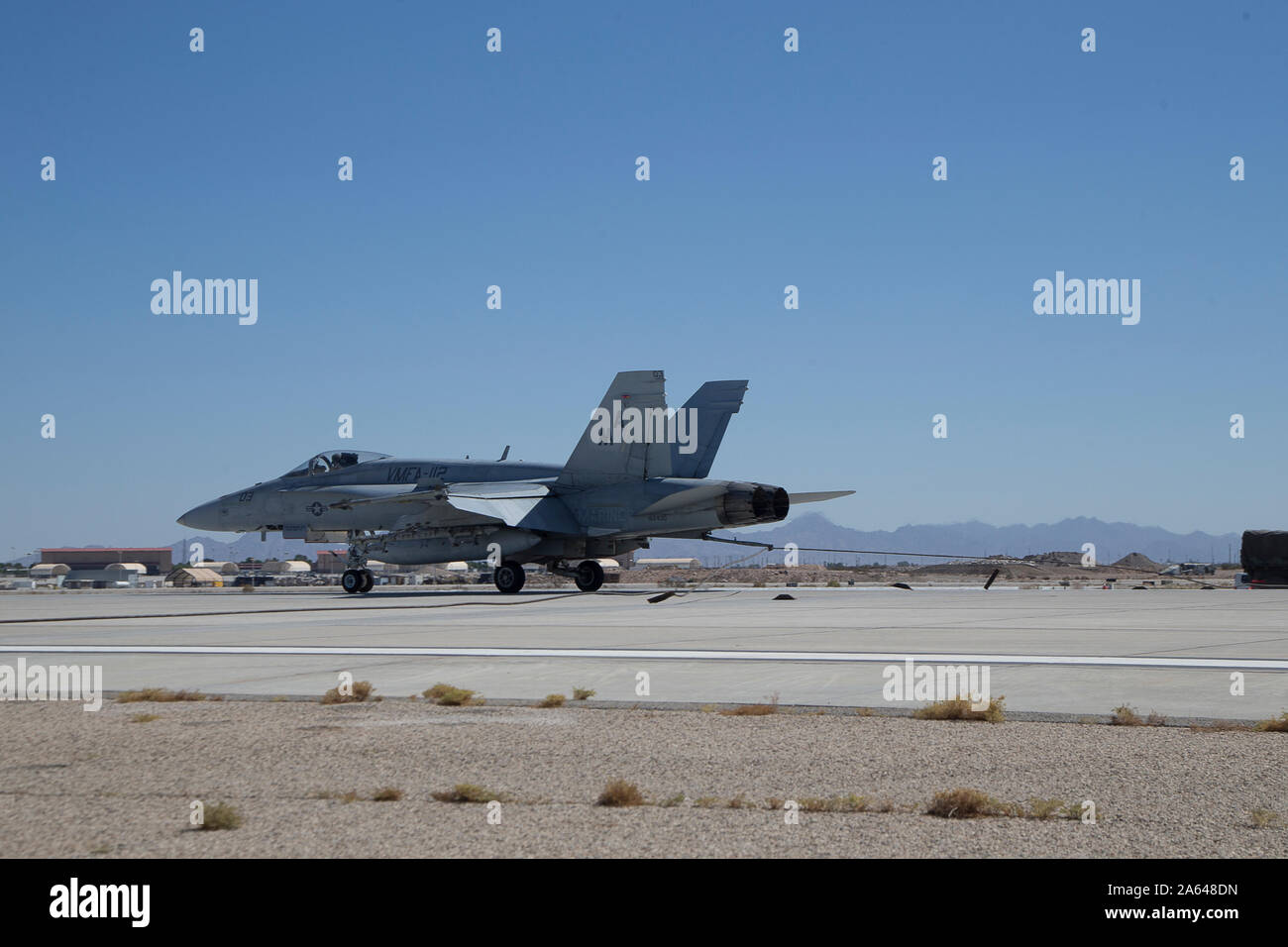 A U.S. Marine Corps F/A-18D Hornet aircraft assigned to Marine Aviation Weapons and Tactics Squadron One (MAWTS-1) conducts an arrested landing during Weapons and Tactics Instructor (WTI) course 1-20 at Marine Corps Air Station Yuma, Arizona, Sept. 30, 2019. WTI is a seven-week training event hosted by MAWTS-1, which emphasizes operational integration of the six functions of Marine Corps aviation in support of a Marine Air Ground Task Force. WTI provides standardized advanced tactical training and certification of unit instructor qualifications to support Marine aviation training and readiness Stock Photo