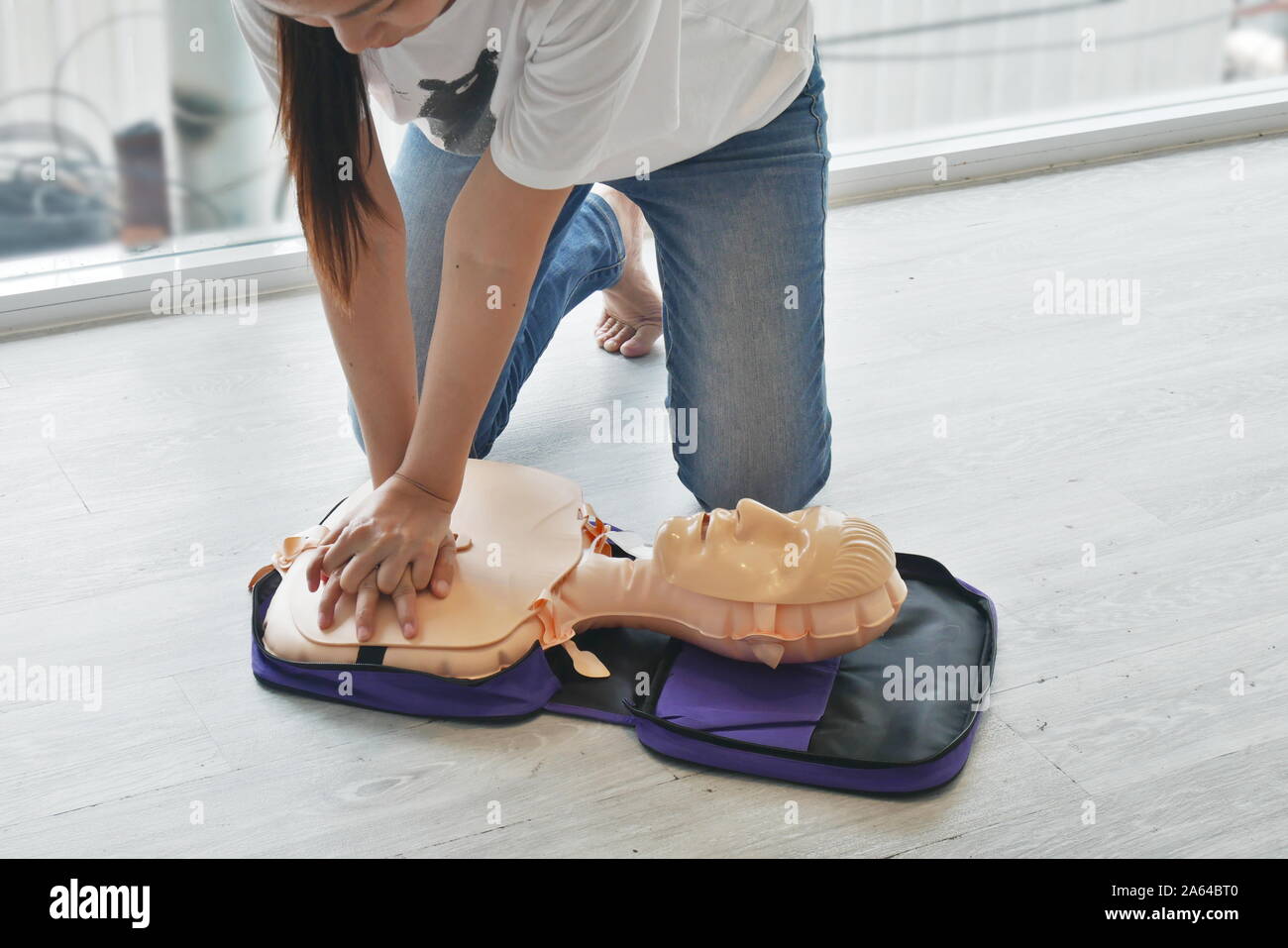 cpr training. close-up of trainee's hand pump on chest of dummy on CPR First Aid Training course for primary safe life Stock Photo