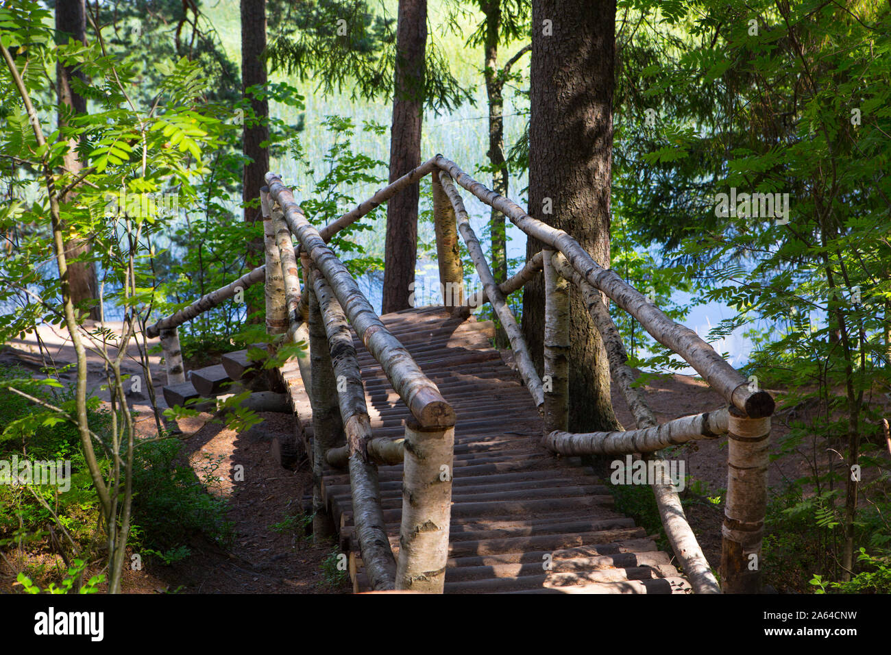 Wooden bridge over the river Stock Photo - Alamy