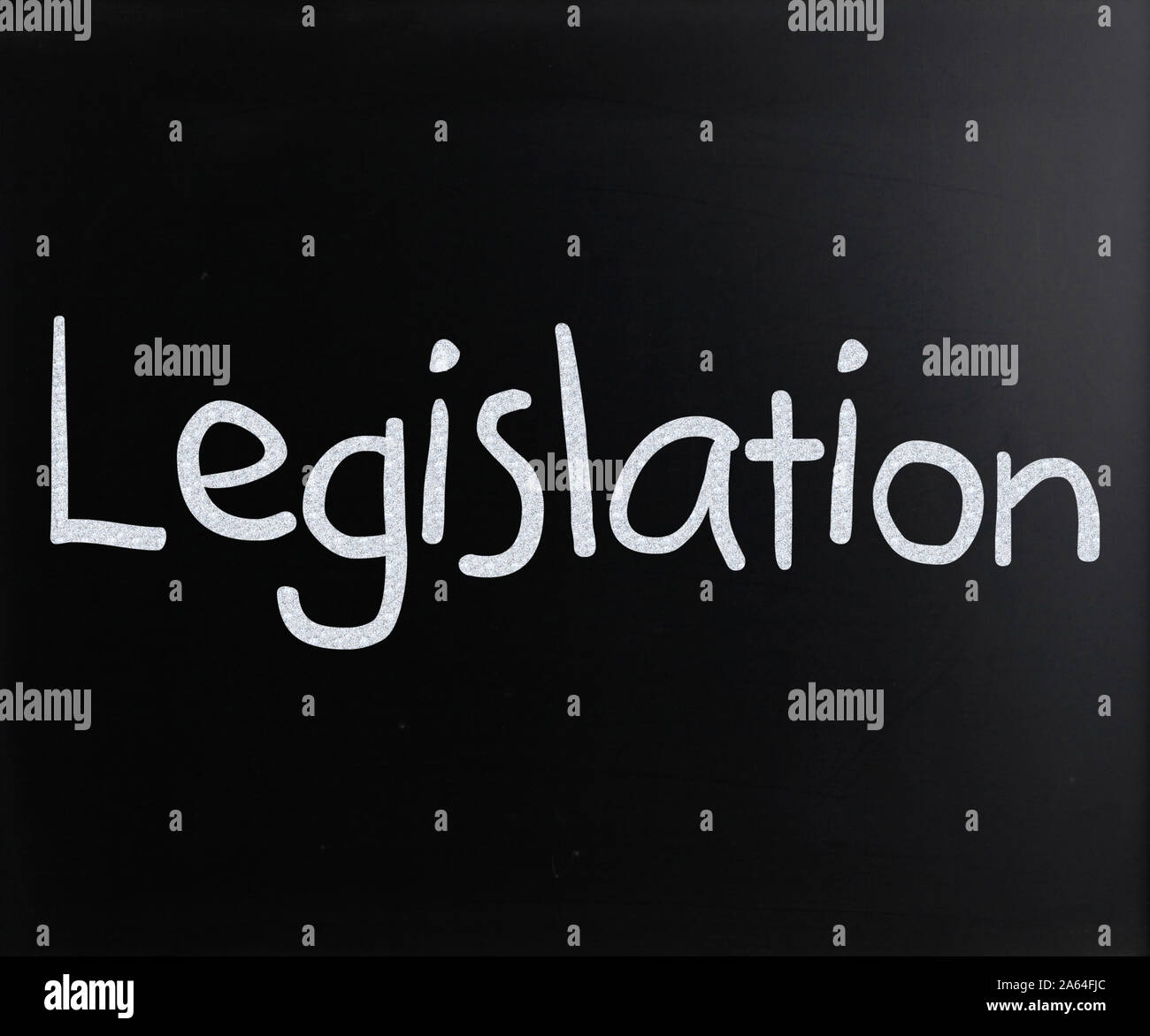 The word "Legislation" handwritten with white chalk on a blackboard