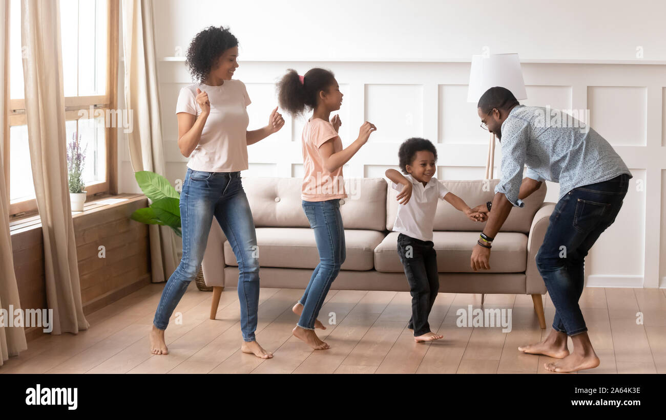 Happy black family have fun dancing at home Stock Photo - Alamy