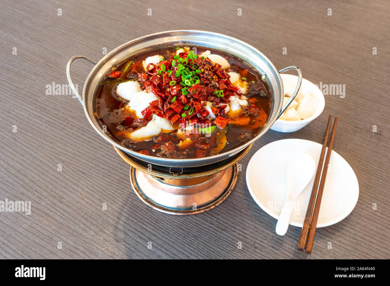 Sichuan spicy boiled fish hot pot with red hot spicy chilli. Asia China