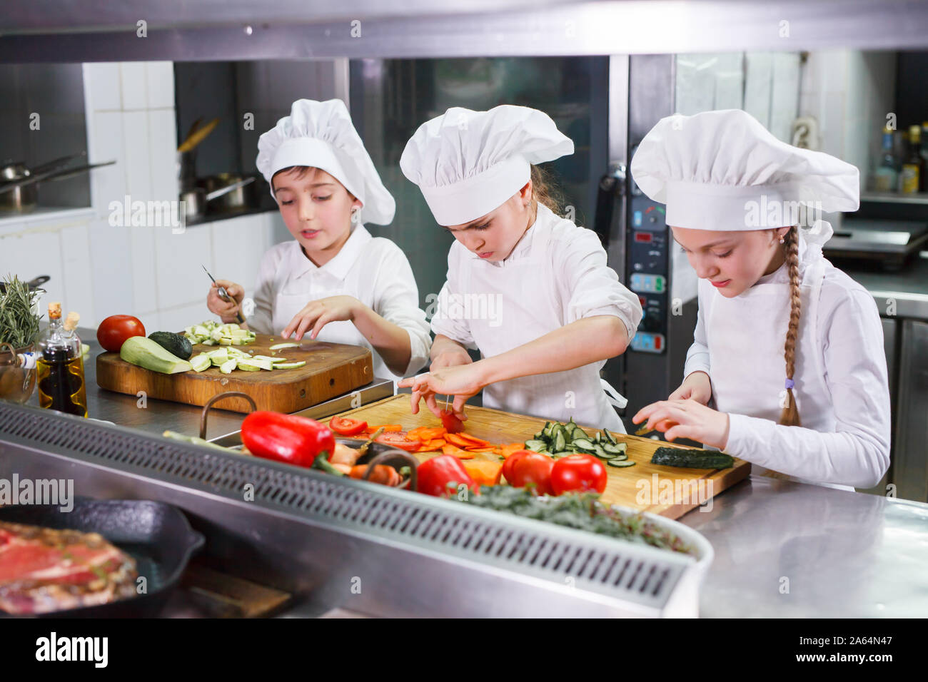 children cooking lunch in a restaurant kitchen Stock Photo - Alamy