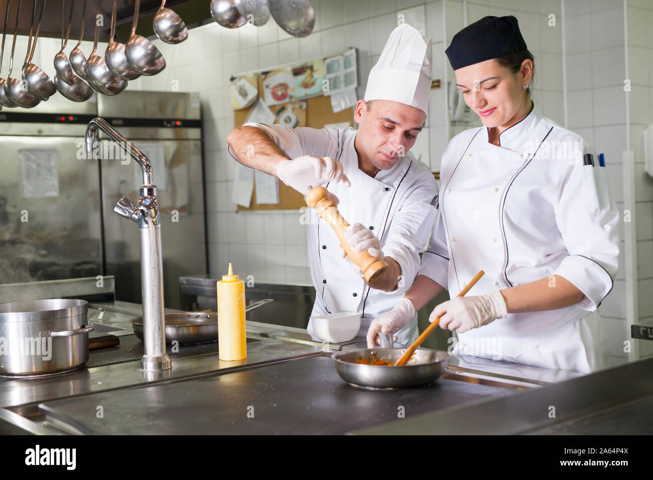 Work About Cook the work of the cook in the kitchen of the restaurant Stock Photo - Alamy
