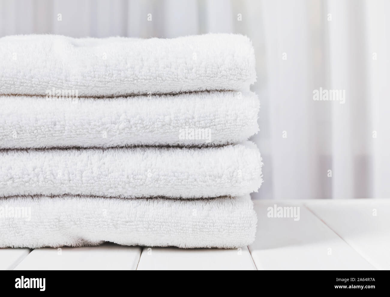 Pile of white cotton bathroom towels close-up Stock Photo