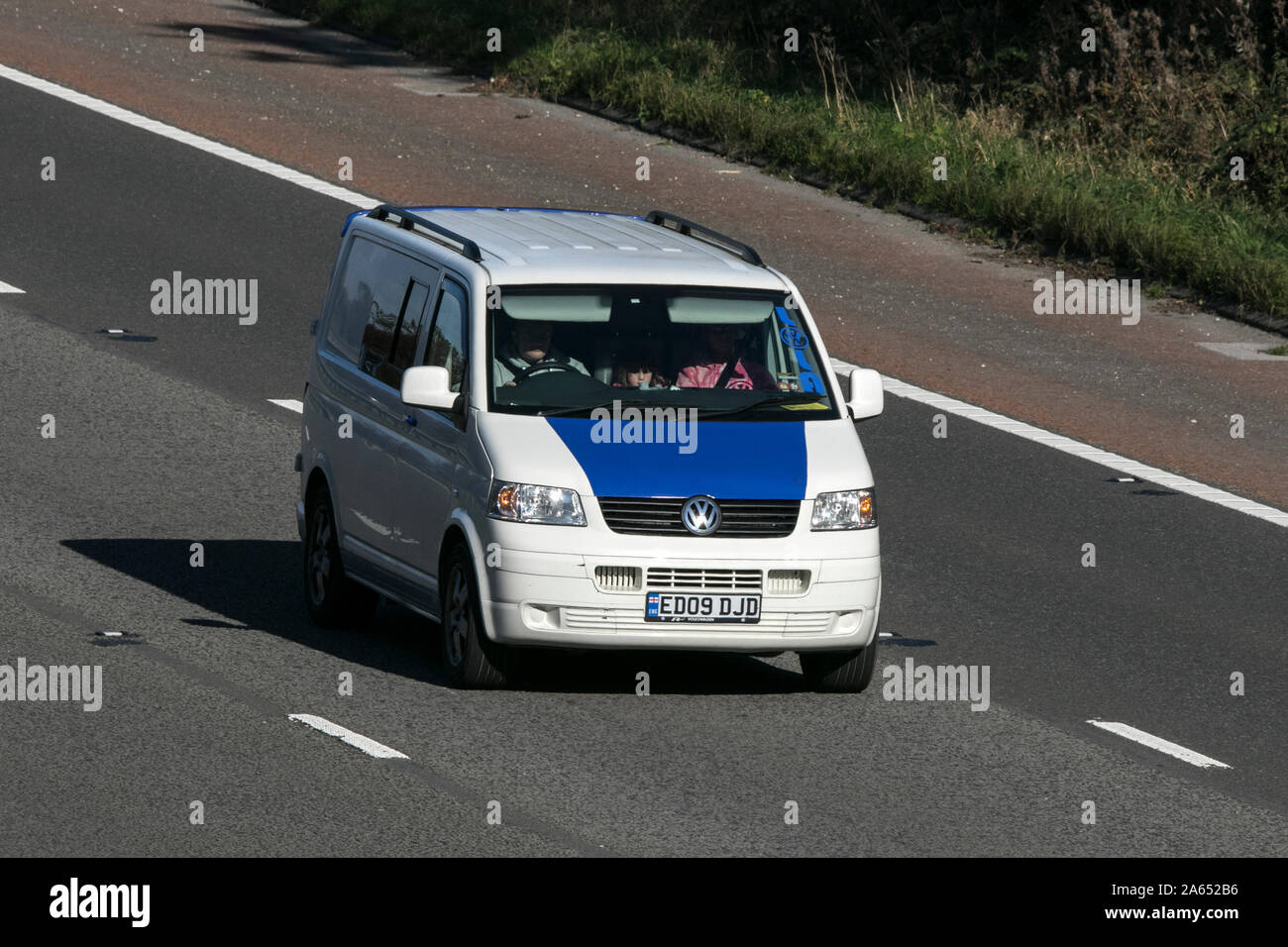 A VW Volkswagen camper van traveling on the M6 motorway near Preston in Lancashire, UK Stock Photo