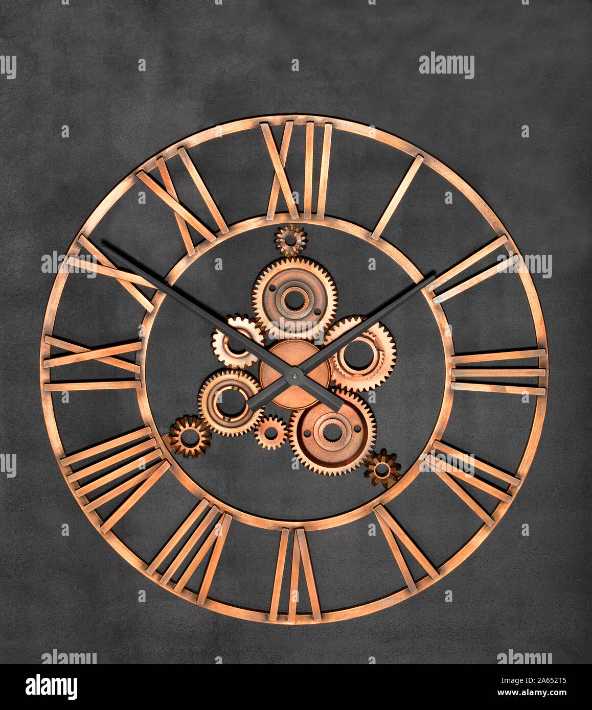 Round industrial wall clock made of metal and real gears on a granite ...