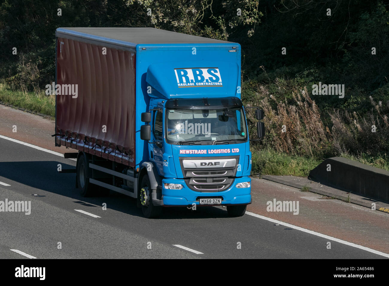 Newstrade logistics Ltd DAF R.B.S haulage contractors traveling on the M6 motorway near Preston in Lancashire, UK Stock Photo