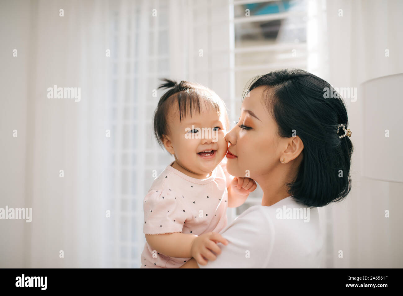 Single mom and daughter portrait. Happy family and people concept. Mother and Children day theme. Stock Photo