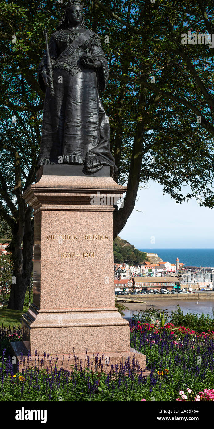 Statue of Queen Victoria on a Marble Plinth Surrounded by a Beautiful Flower Garden in Scarborough North Yorkshire England United Kingdom UK Stock Photo