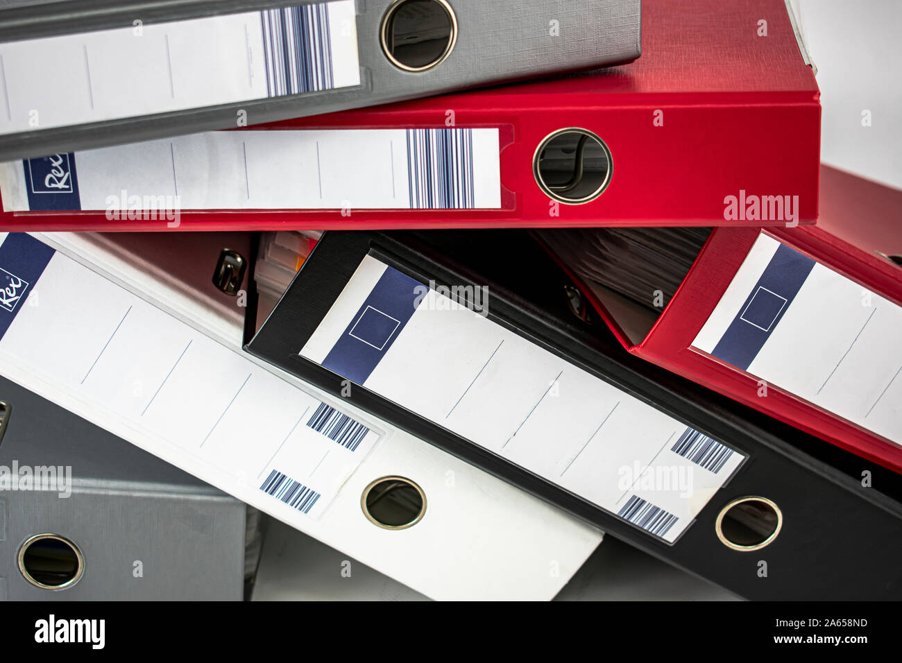 Office document filing of different colors on white background Stock Photo Alamy
