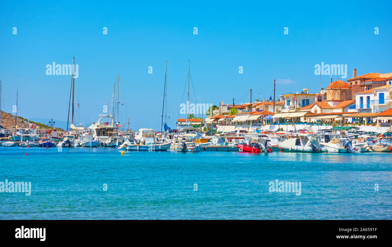 Panoramic view of greek fishing village by the sea on sunny summer day, Perdika, Aegina Island, Greece Stock Photo