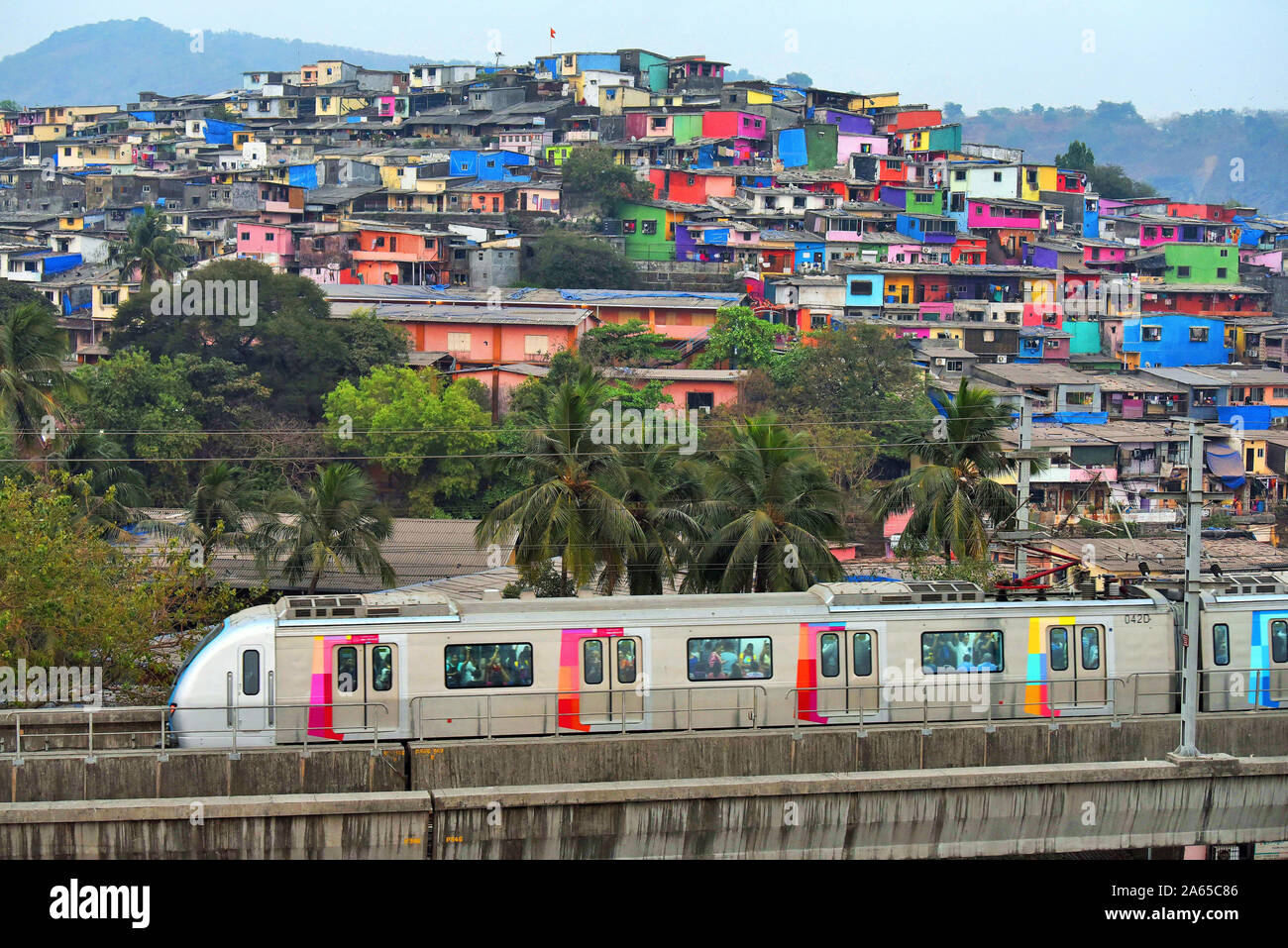 Metro train near Asalpha railway station, Mumbai, Maharashtra, India, Asia Stock Photo