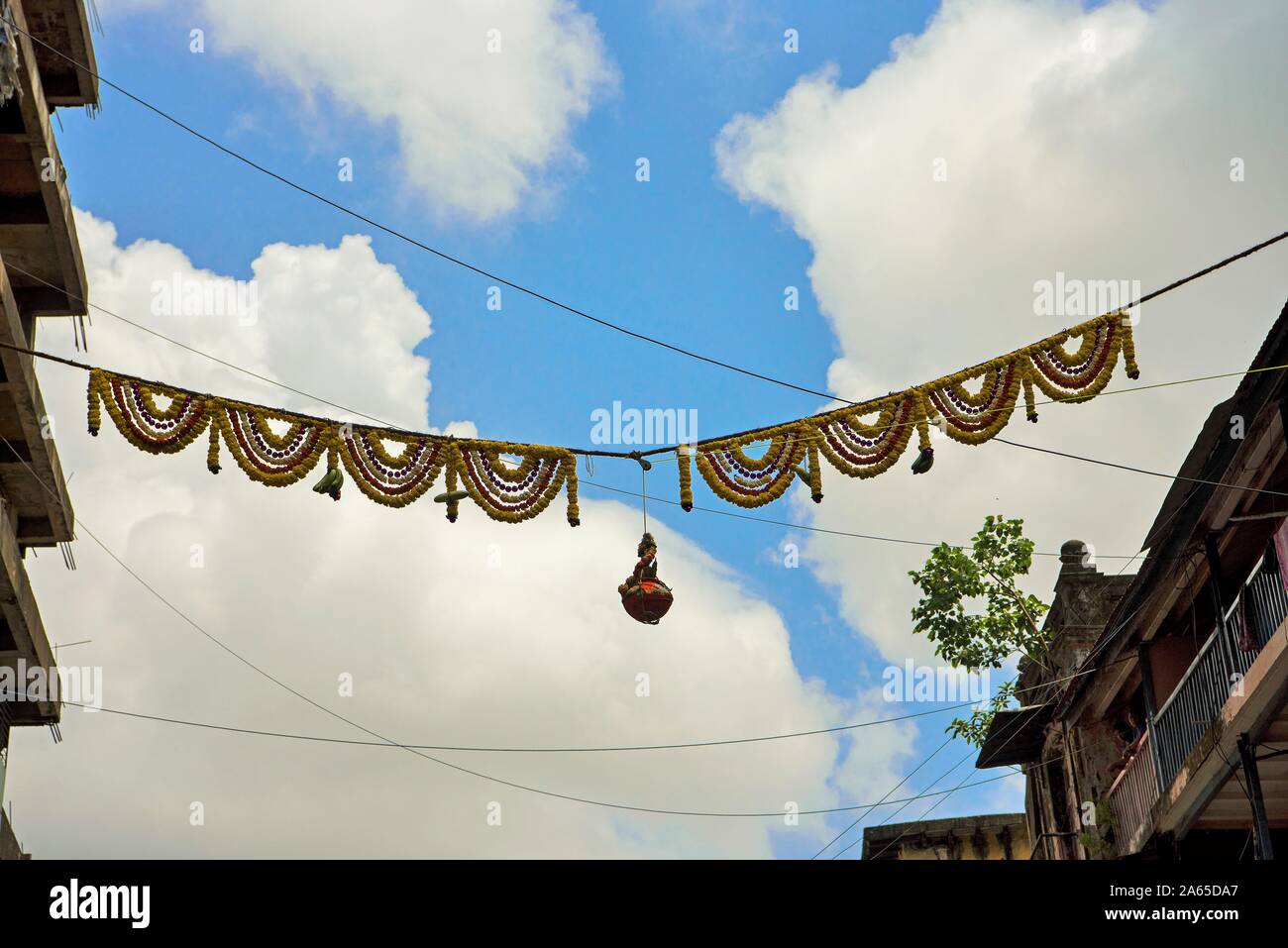 Earthen pot filled with yogurt tied to rope, Janmashtami festival, Mumbai, Maharashtra, India, Asia Stock Photo