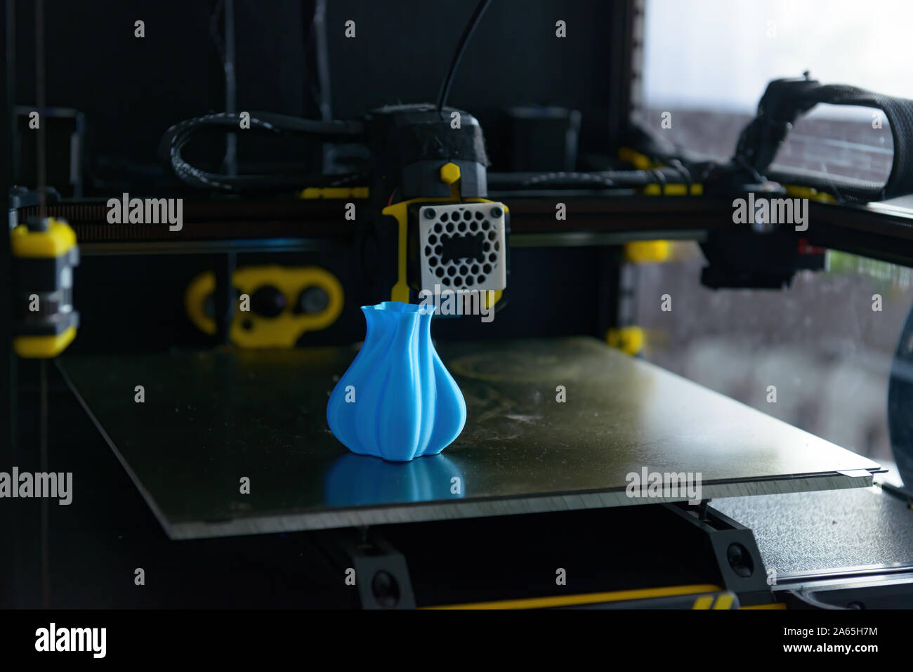 Modern 3d printer with printed three dimentional model of vase. Stock Photo