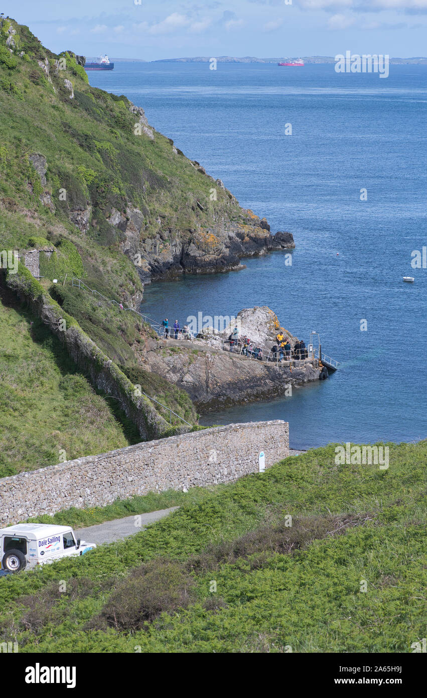 Visitors at Martin's Haven, Pembrokeshire, awaiting the arrival of a ...