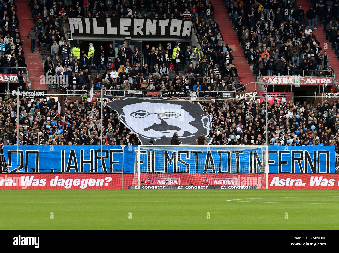 Choreography of the fans of St.Pauli for the 20th anniversary of Filmstadt Inferno 99 (Ultras of SV Babelsberg 03), football 2. Bundesliga, 10.matchday, matchday10, FC St. Pauli Hamburg Hamburg (Pauli) - Darmstadt 98 (DA) 0 : 1, 19.10.2019 in Hamburg / Germany. DFL REGULATION PROHIBES ANY USE OF PHOTOGRAPH AS IMAGE SEQUENCES AND / OR QUASI VIDEO. vǬ | usage worldwide Stock Photo