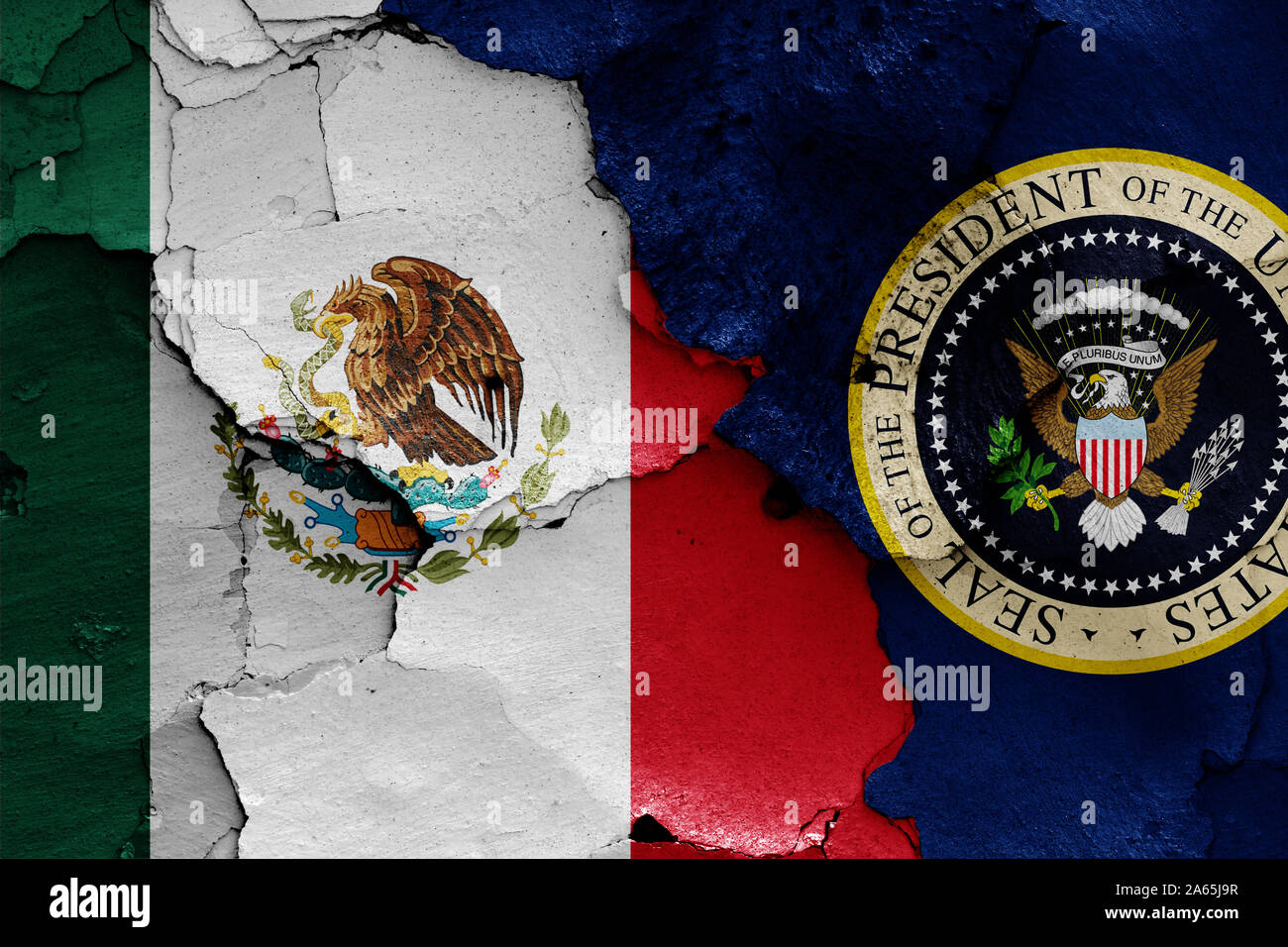 flags of Mexico and President of the United States painted on cracked wall Stock Photo