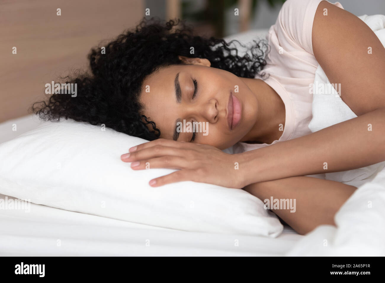 Black girl lying on bed asleep hi-res stock photography and images - Alamy