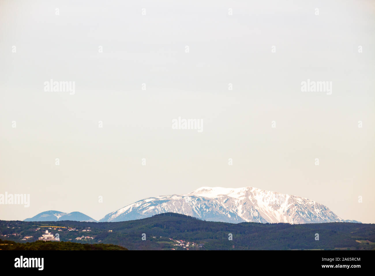 Mountain Schneeberg, Rax and Forchtenstein Castle on left in clear weather seen view from Sopron, Hungary Stock Photo