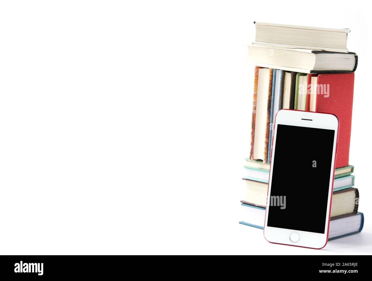 Stack of colored books and mobile phone, Mobile library in smartphone concept, audiobooks, Listening to e-books in audio format. Books online. Educati Stock Photo